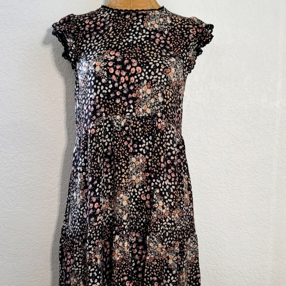 Floral baby doll style dress with flutter sleeve. Medium